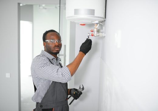 Professional engineer doing a boiler inspection at home.
